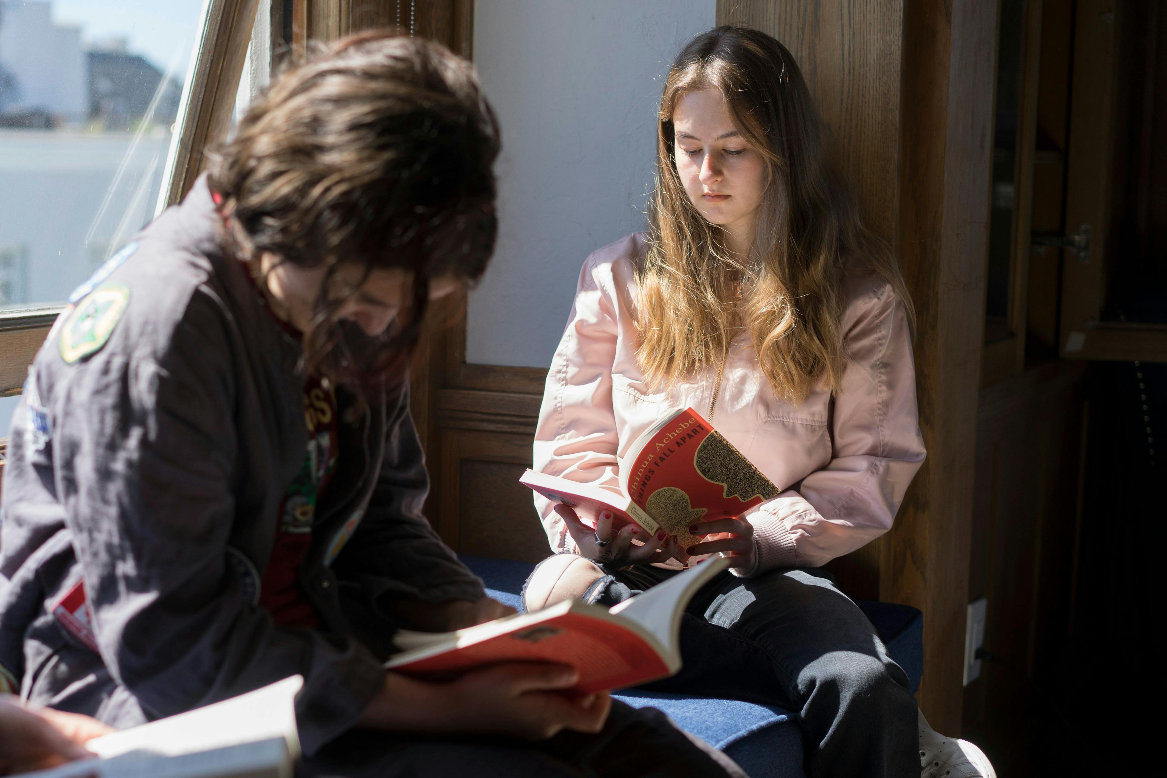 two students reading at ATI Chantilly