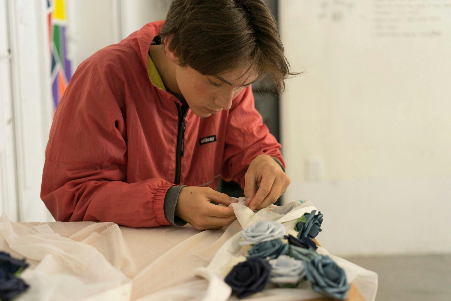 ati san francisco student working with fabric making roses